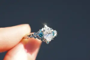 briar rose three stone with .7ct oval lab diamond and aqua diamond