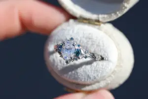 briar rose three stone with .7ct oval lab diamond and aqua diamond