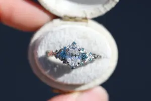 briar rose three stone with .7ct oval lab diamond and aqua diamond