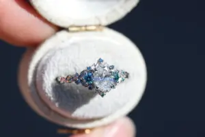 briar rose three stone with .7ct oval lab diamond and aqua diamond