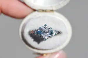 briar rose three stone with .7ct oval lab diamond and aqua diamond