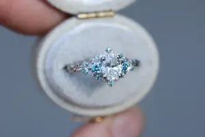 briar rose three stone with .7ct oval lab diamond and aqua diamond