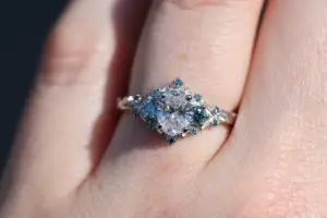briar rose three stone with .7ct oval lab diamond and aqua diamond