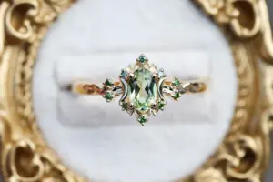briar rose halo moon with 6x4mm oval lab green sapphire