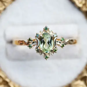 briar rose halo moon with 6x4mm oval lab green sapphire